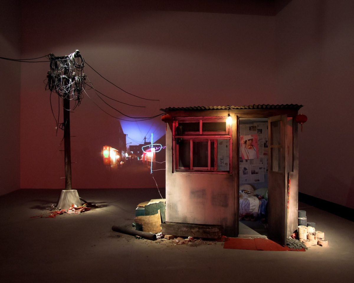 Tracey Snelling, Wang’s House, 2009, mixed media installation with video, house: 197 x 203 x 203 cm, telephone pole: 344 x 80 x 50 cm, courtesy of the artist and Aeroplastics Contemporary, Brussels Copyright: The artist